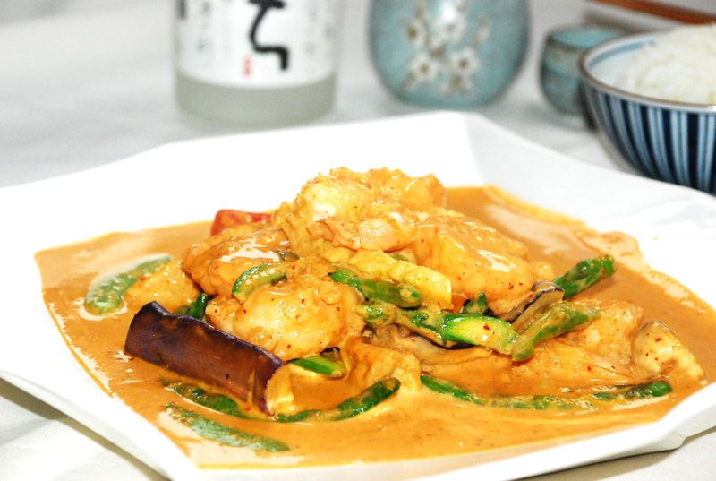Thai Red Curry Chicken-- Chicken cooked in our very own spicy red curry with red and green bell peppers, onions, string beans, zucchini, broccoli, baby corn, eggplant, snow peas, asparagus and tofu